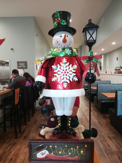 Our snowman guard welcomes you to the cafe.